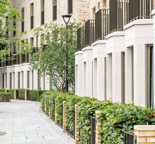 modern residential building with greenery and walkways